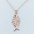 Close-up of rose gold fishbone pendant with opal inlay and black stone eye on chain - Rose Gold / Pink (With Chain)