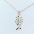 Close-up of rose gold fishbone pendant with green opal inlay and black diamond eye - Rose Gold / Green (With Chain)
