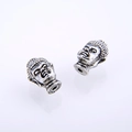 Detailed macro view of vintage silver Buddha head beads for DIY jewelry making - Antique Silver