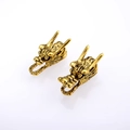 Vintage bronze dragon head charms for DIY jewelry making with intricate carved details - Antique Gold