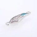 Macro shot of silver plated angel wing connector with blue opal and pave zircons - Silver Green Opal