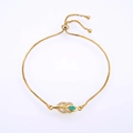 Macro detail of leaf-shaped bracelet with green opal and adjustable bolo clasp - Gold Chain Green Synthetic Opal