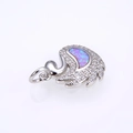 Detail of swan pendant with opal stone inlay and shimmering white zircon accents - Platinum Pink Opal