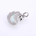 Macro shot of silver swan pendant featuring white fire opal and sparkling zircon crystals - Platinum White Opal