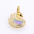 Detailed close-up of a golden swan pendant featuring a vibrant purple fire opal stone - Gold Pink Opal