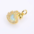 Detailed view of swan pendant with iridescent opal stone and pavé crystal accents - Gold White Opal