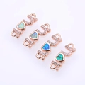 Close-up of rose gold LOVE connectors with colorful opal hearts and zircon stones - Rose Gold Multicolored