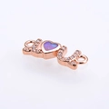 Macro detail of rose gold LOVE connector with heart opal and sparkling crystals - Rose Gold Pink