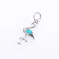 Detailed macro view of silver flamingo pendant with blue-green opal inlay gemstone - Platinum Green Opal Pendant
