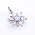 Close-up of a silver sunflower pendant with pink opal center and clear zircon petals - Platinum Pink Opal Pendant