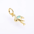 Macro shot of gold flamingo pendant featuring a vibrant blue oval opal gemstone inlay - Gold White Opal Pendant