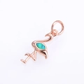 Macro shot of rose gold flamingo pendant featuring a vibrant blue-green opal inlay - Rose Gold Green Opal Pendant