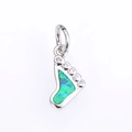 Detailed close-up of a silver baby footprint pendant with opal and cubic zirconia - Platinum Green Opal Pendant
