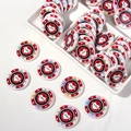 Macro view of Las Vegas Poker Club acrylic chips with crown motifs and heart logo - Red