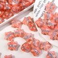 Vista detallada de cuentas acrílicas con forma de estrella y óvalo con textura de mármol - Rojo Naranja + Gris Roca