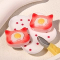 Macro shot of miniature resin cat-shaped toast models with fried egg details - Strawberry Cat Biscuit With Fried Egg