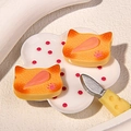 Macro shot of cat-shaped toast resin charms with realistic crust texture and pink paw prints - Cat Biscuit With Pink Jam