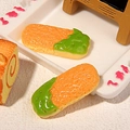 Macro shot of miniature green tea cookies and swiss roll cake resin accessories - Matcha Finger Biscuit
