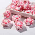 Macro shot of pink resin DIY beads with iridescent centers for jewelry making - Pink Cream with Bow Heart