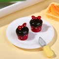 Miniature resin chocolate cupcakes with red polka dot bows and white plate - Red Base Bow Style