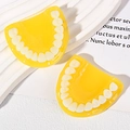 Detailed view of yellow U-shaped resin tooth charms for DIY jewelry and accessories - Yellow