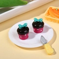 Miniature pink resin cupcake model with chocolate topping and teal polka dot bow decoration - Rose Red Base Bow Style
