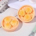 Macro shot of miniature Chinese soup dumplings in resin steamers with glossy finish - Soup Dumplings