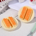 Macro shot of miniature Chinese fried dough sticks food model on small plates - Fried Dough Stick