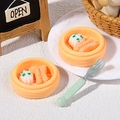 Miniature orange dim sum steamers with realistic shrimp dumplings and a tiny green fork - Scallion Roll and Sausage