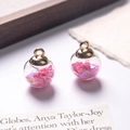 Macro shot of glass ball pendant with pink heart sequins and gold metal cap details - Light Pink
