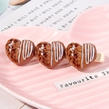 Cute Japanese style hair clip featuring three heart-shaped chocolate charms with wavy drizzle - Heart Chocolate