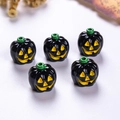 Detailed view of glossy pumpkin beads for Halloween jewelry making and DIY accessories - Black