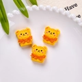 Miniature resin bear cookies with orange bows and textured finish for DIY crafts - Cheese Bear Biscuit Style