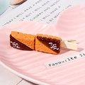 Cute resin biscuit hair clip with chocolate and orange finish on a pink heart plate - Two-Tone Cookie