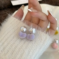 Sweet purple flocked heart earrings with pearls on a model wearing a white sweater - Purple