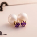 Detail of double-sided earring with white pearl and purple gemstone in gold claw setting - Purple