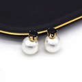 Elegant double-sided earrings with black faceted stone and large white pearl drops - Black
