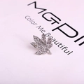 Sparkling maple leaf brooch pin with white crystals on a premium silver metal base - Silver