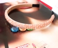 Macro detail of a handmade pink crystal beaded headband on a fashion magazine - Pink