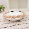 Detail of handmade champagne crystal beaded headband with satin lining and protective tips - Champagne