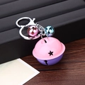 Detail of pink and purple bell keychain with star cutout and silver metal clasp - Purple + Pink (G02-6)