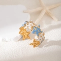 Anello a stella marina dorata regolabile con smalto bianco e azzurro chiaro - Stella Marina Bianco Viola (S994)