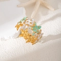 Bracciale a forma di stella marina dorata con smalto verde menta e bianco su sabbia - Stella Marina Bianco Verde (S996)