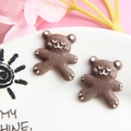Macro shot of resin brown bear biscuit charms with textured matte finish and hand-painted details - Brown Bear