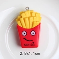 Macro shot of 2.8x4.1cm french fries keychain pendant on white ceramic plate - Smiley French Fries (With Eye Hook)