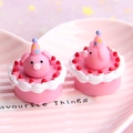Macro shot of two miniature pink pig resin cakes with cream borders and strawberry details - Note Size Is Large Like Lychee / Deep Pink
