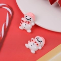 Detailed macro shot of cute resin snowman charms for Christmas DIY craft and phone case - Snowman with Pink Hat and Scarf