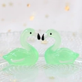 Close-up of two mint green translucent resin swan figurines with smooth finish - 2.7x2.8cm / Light Green