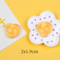 Macro detail of miniature resin bread twist model with golden texture and 2x1.9cm dimensions - Twist Bread
