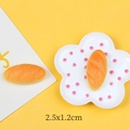 Macro detail of miniature resin baguette with realistic texture for DIY crafts - Baguette Bread